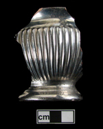 Overall silver luster on molded sugar bowl. Note: red earthenware paste.